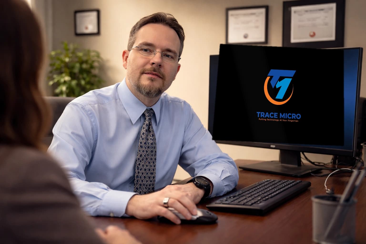 Trace Micro residential and commercial IT hardware consultation and network planning session in a professional office